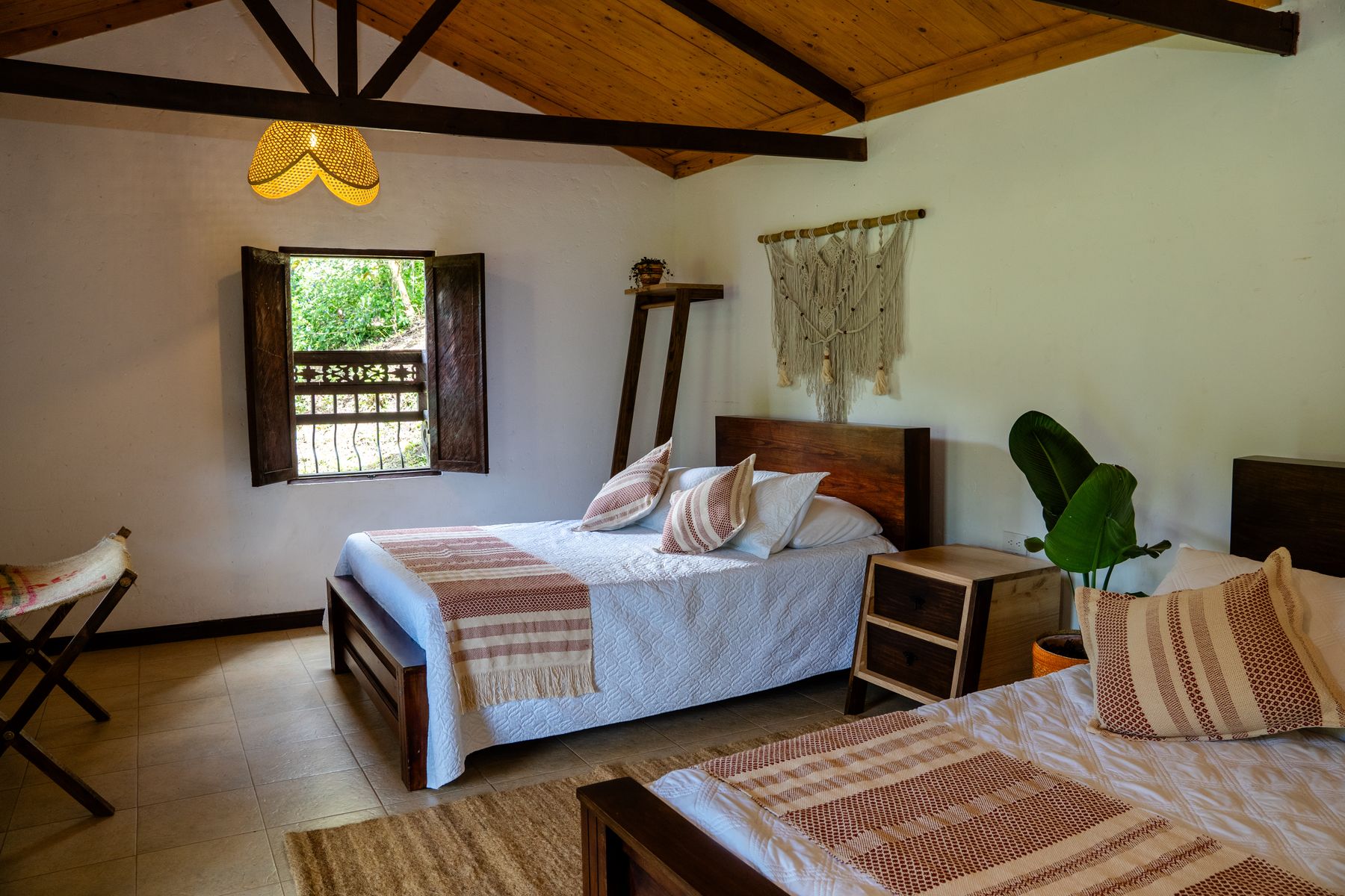 Twin bedroom with macrame wall hangings