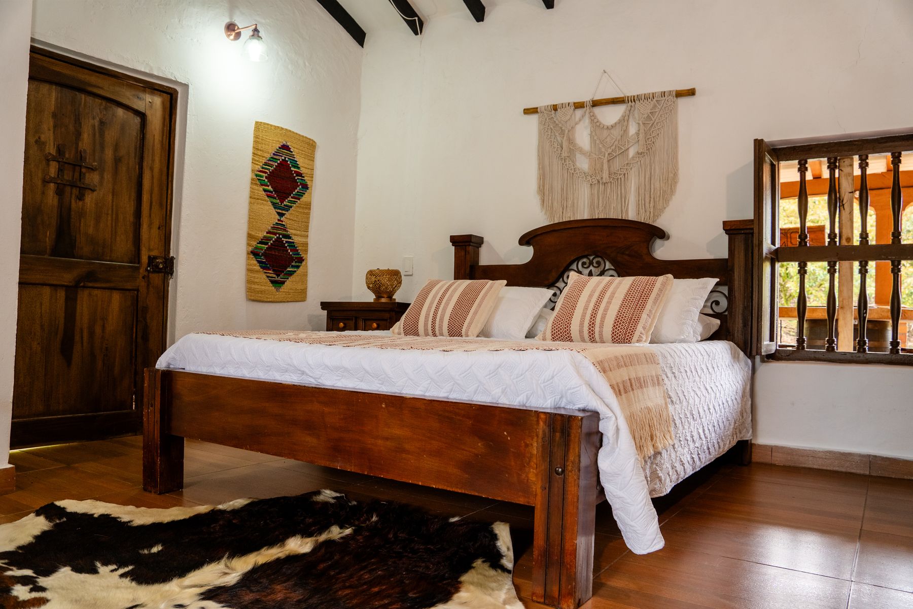 Bedroom with carved headboard